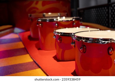 lined up orange drum set - Powered by Shutterstock