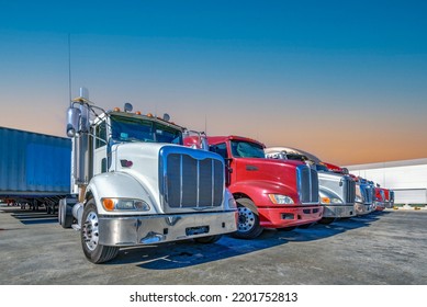 Lined Up Semi Trucks On A Parking Lot At Logistics Warehouse