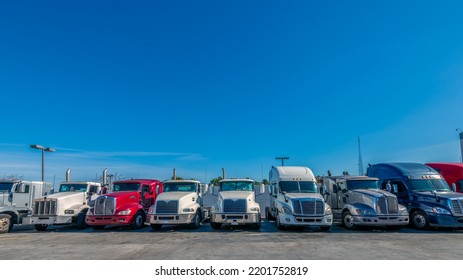 Lined Up Semi Trucks On A Parking Lot At Logistics Warehouse