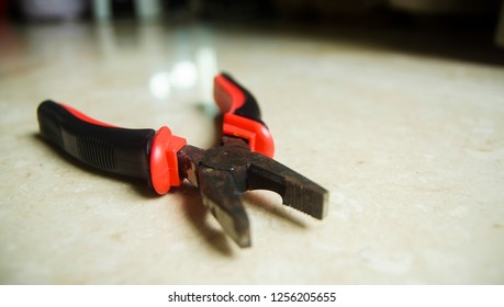 Lineman's Pliers On The White Floor.