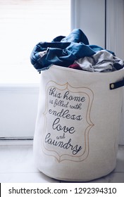 Linen Laundry Hamper Or Basket Full Of Dirty Laundry With A Phrase On It THIS HOME IS FILLED WTH ENDLESS LOVE AND LAUNDRY