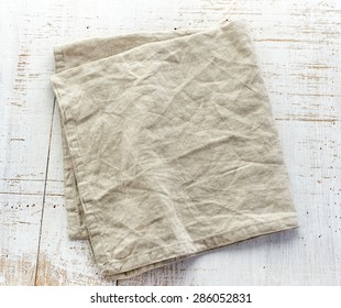 Linen Napkin On White Wooden Table