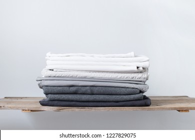 Linen Textile In Stacked Pile. Sheet And Cover. Different Shades White Grey Pastel Color Cloth. Background. Copy Spase