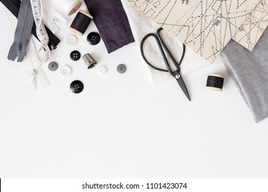 Linen Textiles, Scissors And Sewing Supplies On White Desk