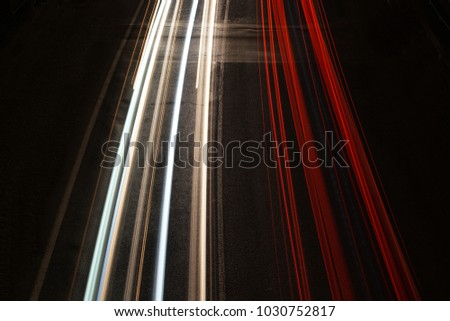 Lines of car lights in the night, trails. Long exposure photo.