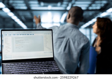 Lines of code on laptop display used by data center technicians to execute security patches. Close up of programming language on notebook used by server hub employees scanning equipment