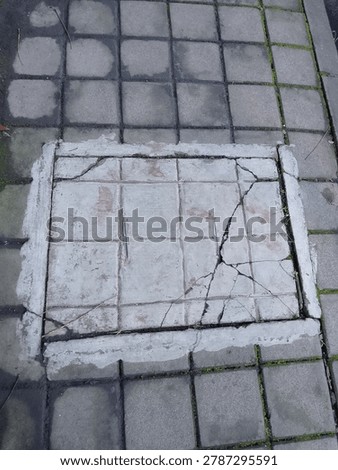 Lines, cracks, and quiet patterns. Just an ordinary pavement, but the geometry holds its own kind of beauty. Finding art in the everyday.