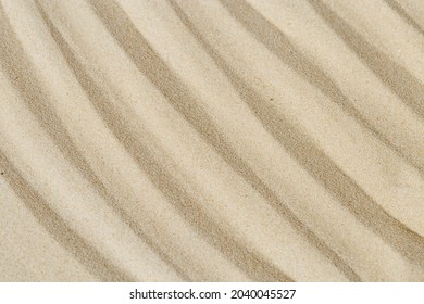 Lines Drawing On Sand, Beautiful Sandy Texture. Spa Background, Concept For Meditation And Relaxation. Concentration And Spirituality In Japanese Zen Garden. View From Above.