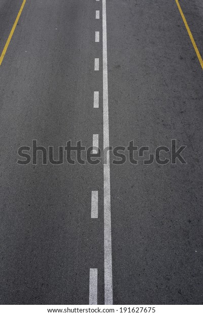 Lines and lane markings on the on asphalt road
surface texture