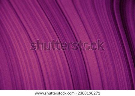 Lines on a purple background. The texture of an abstract geometric pattern diagonally. Computer display screen background.
