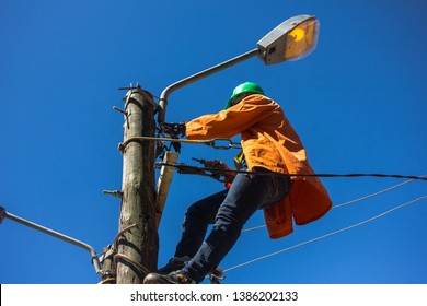 Lineworker Doing Maintenance Of Street Lamps In Africa