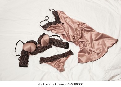 Lingerie lying down on the bed.