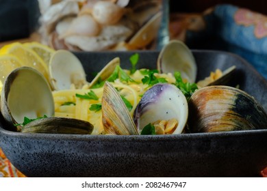 Linguine With Littleneck White Wine Clam Sauce And Parsley Garnish