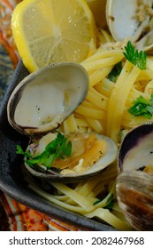 Linguine With Littleneck White Wine Clam Sauce And Parsley Garnish