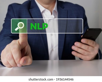  Neuro Linguistic Programming NLP Inscription On The Screen. Close Up Modern Banker Hands Holding Black Smart Phone. 
