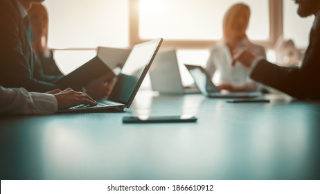 Link build developers testing usability of a new program or website with different operation system laptops in the modern office. Business partners planning a new startup in office. 16x9 size - Shutterstock ID 1866610912