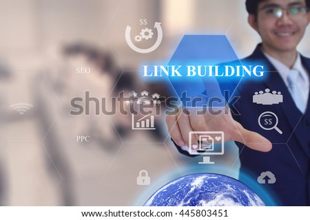 LINK BUILDING  concept presented by  businessman touching on  virtual  screen -image element furnished by NASA- SOFT SILVER TONE