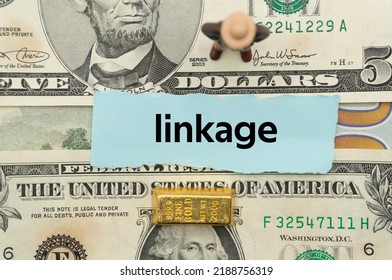 linkage.The word is written on a slip of paper,on colored background. professional terms of finance, business words, economic phrases. concept of economy.