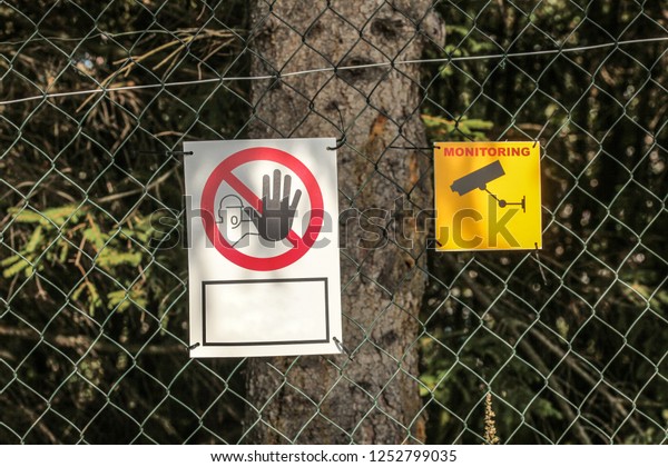 Linked wire fence with \