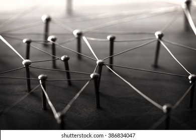Linking entities. Network, networking, social media, internet communication abstract. Web of wires on wood. Monotone or Black and White. 