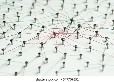 Linking entities, Network simulation, social media, Communications Network, The connection between the two networks. in paper linked together by cotton with a black and red yarn