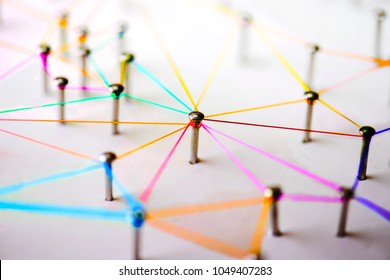 Linking Entities. Networking, Social Media, SNS, Internet Communication Abstract. Devices Or People Connected To A Network. Colorful Web Of Green, Blue, Red And Blue Purple Wires On White Background.