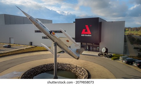 Lint, Antwerp, Belgium 18 March 2021 : Jet Fighter On Display At AED Studios Lint Vaccination Centre For Antwerp During Covid. This Is Also A Film Studio For Belgian Tv. Drone Aerial View From Above