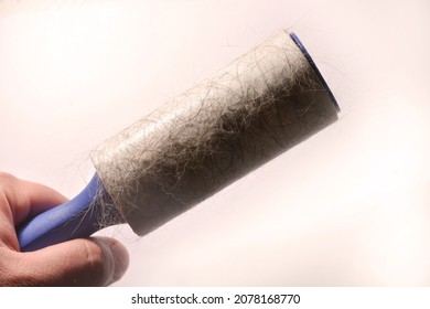 Lint Roller For Clothes With Sticky Hair And Wool. High Quality Photo