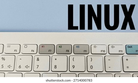 Linux Operating System Concept Close Up of White Computer Keyboard with Function Keys and Linux on Light Background Programming Technology. 