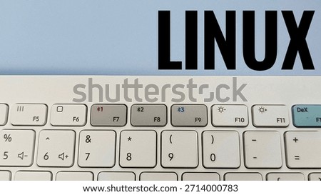 Linux Operating System Concept Close Up of White Computer Keyboard with Function Keys and Linux on Light Background Programming Technology. 