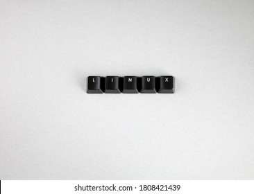 LINUX Spelled Using Black Keys From  Computer Keypad, Open Source Computer Operating System, White Background
