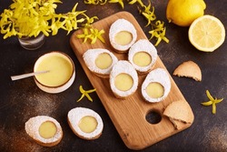Linzer Cookies In A Shape Of Easter Eggs Filled With Lemon Curd