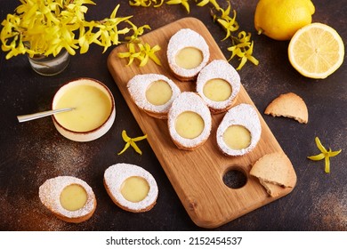 Linzer cookies in a shape of Easter eggs filled with lemon curd