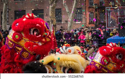 Lion Dance And Confetti In A Crowded Celebration Of Chinese New Year In Chinatown, New York.