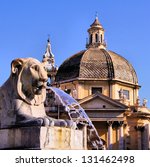 Lion fountain in Piazza del Popolo with church dome Rome, Italy