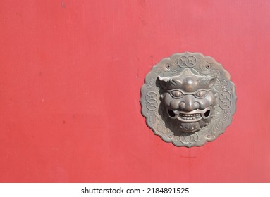 Lion Head Door Knock On Red Background