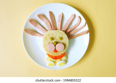 lion made of bread, eggs and sausage. funny idea of dish for Kids. food art. creative breakfast. restaurant menu. snack time. beautiful dinner.           