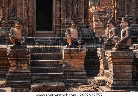 Lion and Monkey Gardians Carvings at Banteay Srei Red Sandstone Temple, Cambodia