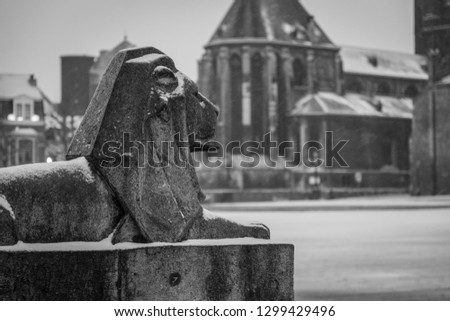 a lion statue in Maastricht, Netherlands in snow