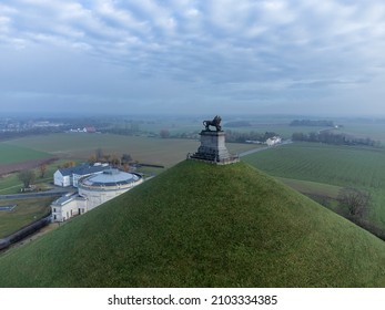 Lion Statue And Visitor Center Behind Butte Du Lion On The Battlefield Of Waterloo Where Napoleon Was Defeated. Drone Aerial View