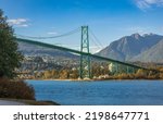 Lions Gate Bridge in summer day, Vancouver, BC, Canada. View of Lions Gate Bridge from Stanley Park. Built in the 1930s, Vancouver
