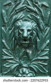 Lions head shaped water spout with 
				laurel leaf. Water spout on a Victorian English fountain.