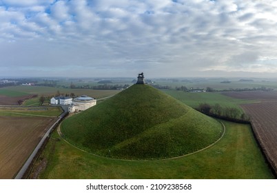 Lion's Mound With Farm Land Around. Butte Du Lion On The Battlefield Of Waterloo Where Napoleon Was Defeated. Drone Aerial View