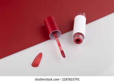 Lip Gloss Applicator With Drops Of Red Gloss