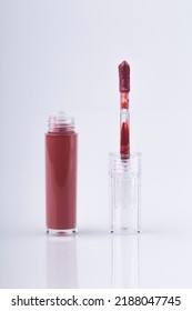 Lip Gloss Applicator With Drops Of Red Gloss