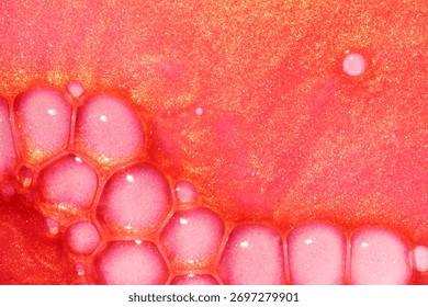 Lip gloss red orange colored with yellow glow shimmering wave textured background