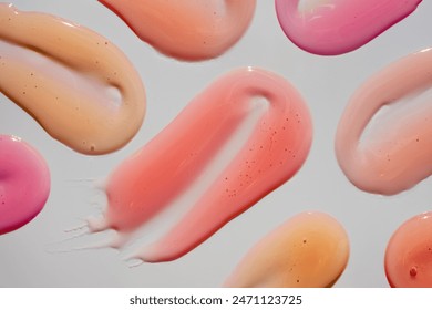 Lip oil or lip gloss texture swatch on gray background - Powered by Shutterstock