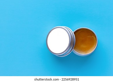 lip scrub balm from natural ingredients isolated on blue background
juxtaposition technique woman hand space for text in middle of box.skin lips care concept cosmetics product - Powered by Shutterstock