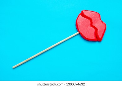lip shaped lollipop on blue background