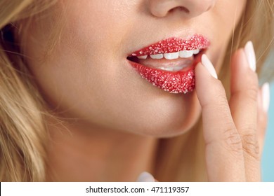 Lip Skin Care. Closeup Of Beautiful Woman's Mouth With Cosmetic Sugar Lip Scrub On. Girl Touching, Exfoliating Her Plump Full Lips Using Scrub To Get Soft Lips. Beauty Concept. High Resolution Image